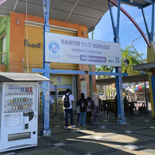 Lumut Jetty Ticket Counter for Pangkor Island Ferry – Kuala Lumpur to Pangkor Transfer Travelers queue at Lumut Jetty ticket counter for ferry to Pangkor Island – Kuala Lumpur to Pangkor Island transfer