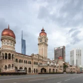 Three generations of architecture seen during a Kuala Lumpur city tour: Sultan Abdul Samad Building, Dayabumi Complex, and Merdeka 118 Tower