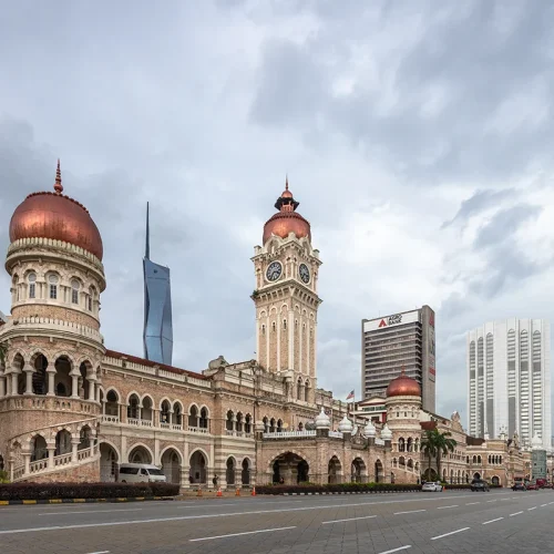 Kuala Lumpur City Tour – Historic and Modern Landmarks Three generations of architecture seen during a Kuala Lumpur city tour: Sultan Abdul Samad Building, Dayabumi Complex, and Merdeka 118 Tower