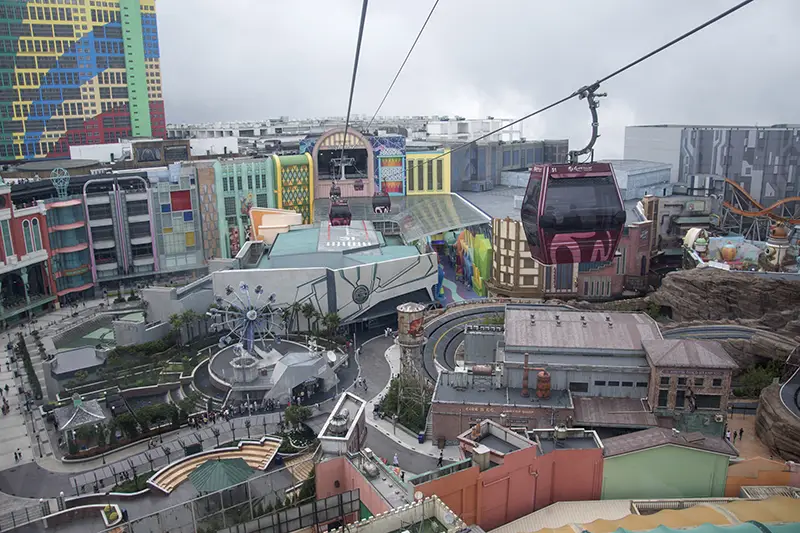 Genting Highlands cable car above Skytropolis theme park on a cloudy day