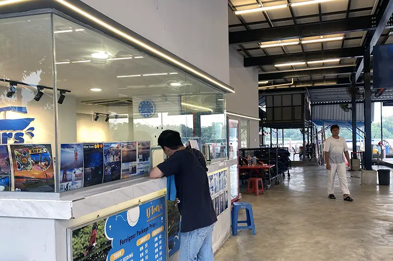 Tourist at the ticket counter at Pasir Penambang Fireflies Jetty in Kuala Selangor