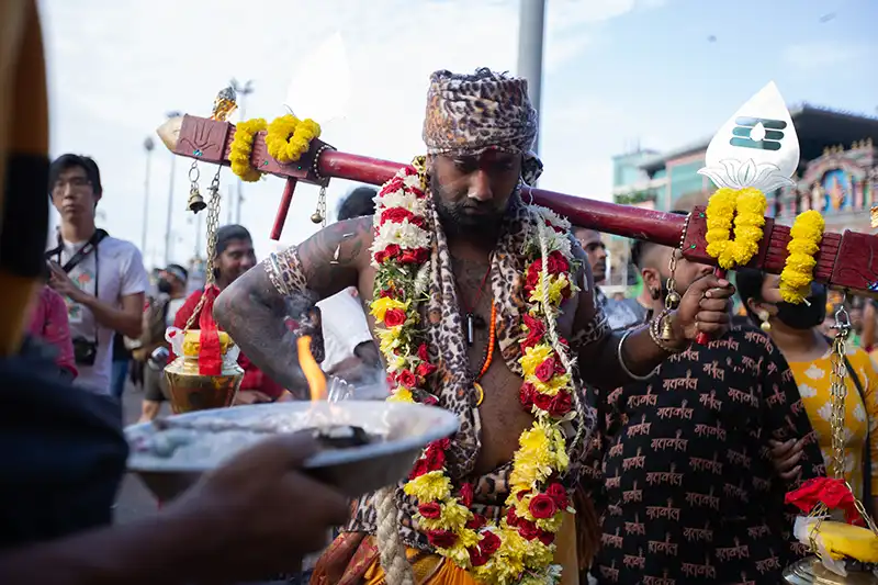 Hindu devotee carrying a kavadi during Thaipusam at Batu Caves — one of the best cultural events to experience in Kuala Lumpur.