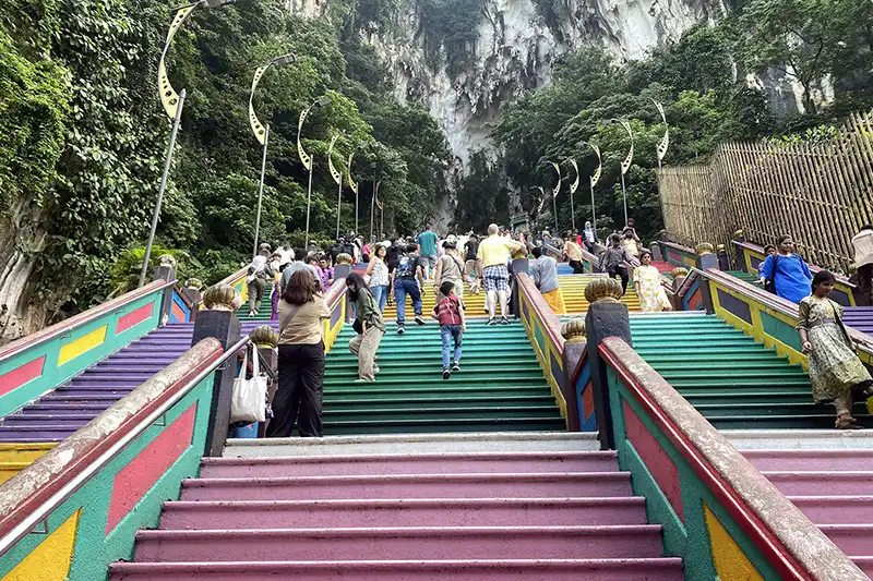 Climbing the 272 rainbow steps at Batu Caves – popular things to do in Kuala Lumpur
