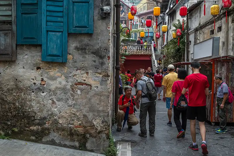 Tourists exploring Chinatown Kuala Lumpur on a walking tour — a highlight featured in the Kuala Lumpur Travel Guide.