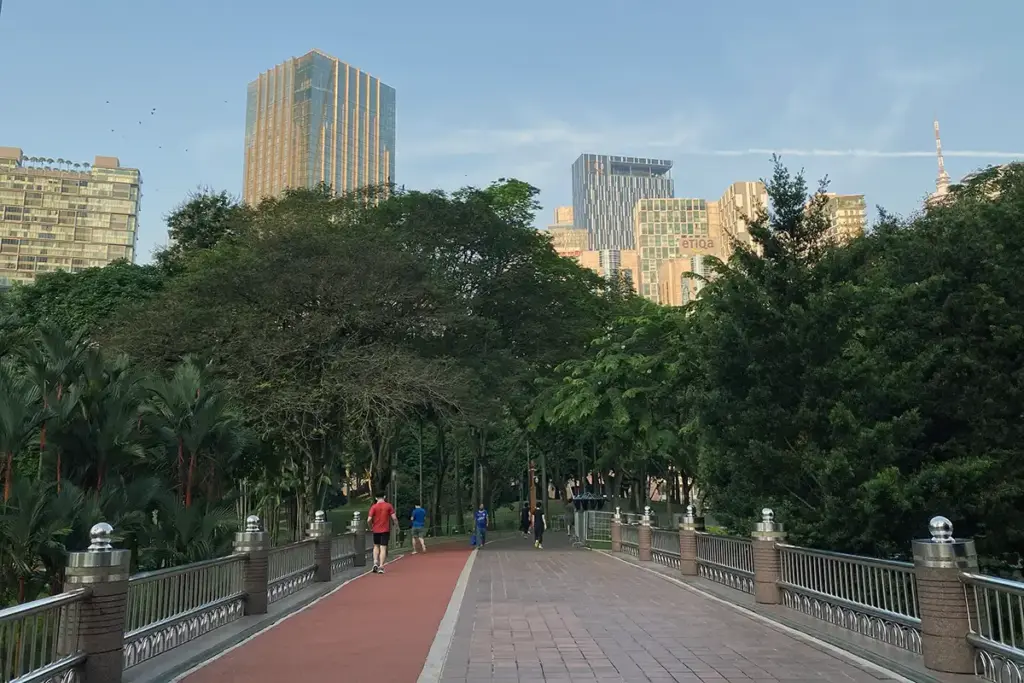 Shaded jogging track at KLCC Park during a cooler time of day