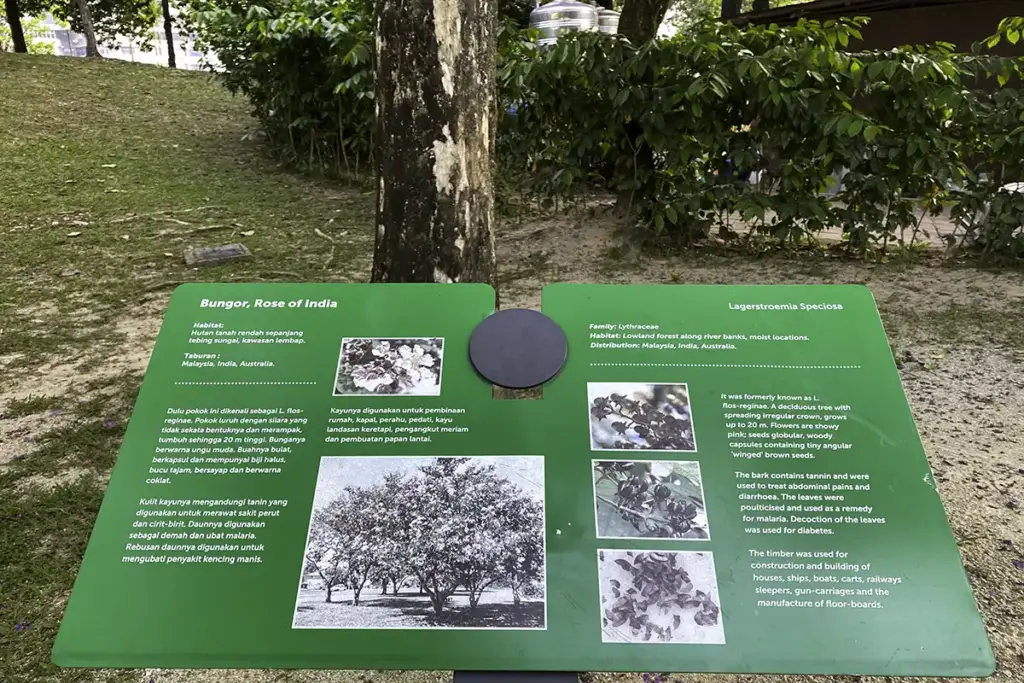 Information board along shaded garden trails at KLCC Park
