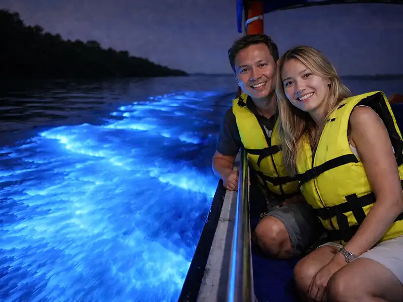 Tourists enjoying blue tears bioluminescent plankton experience in Kuala Selangor