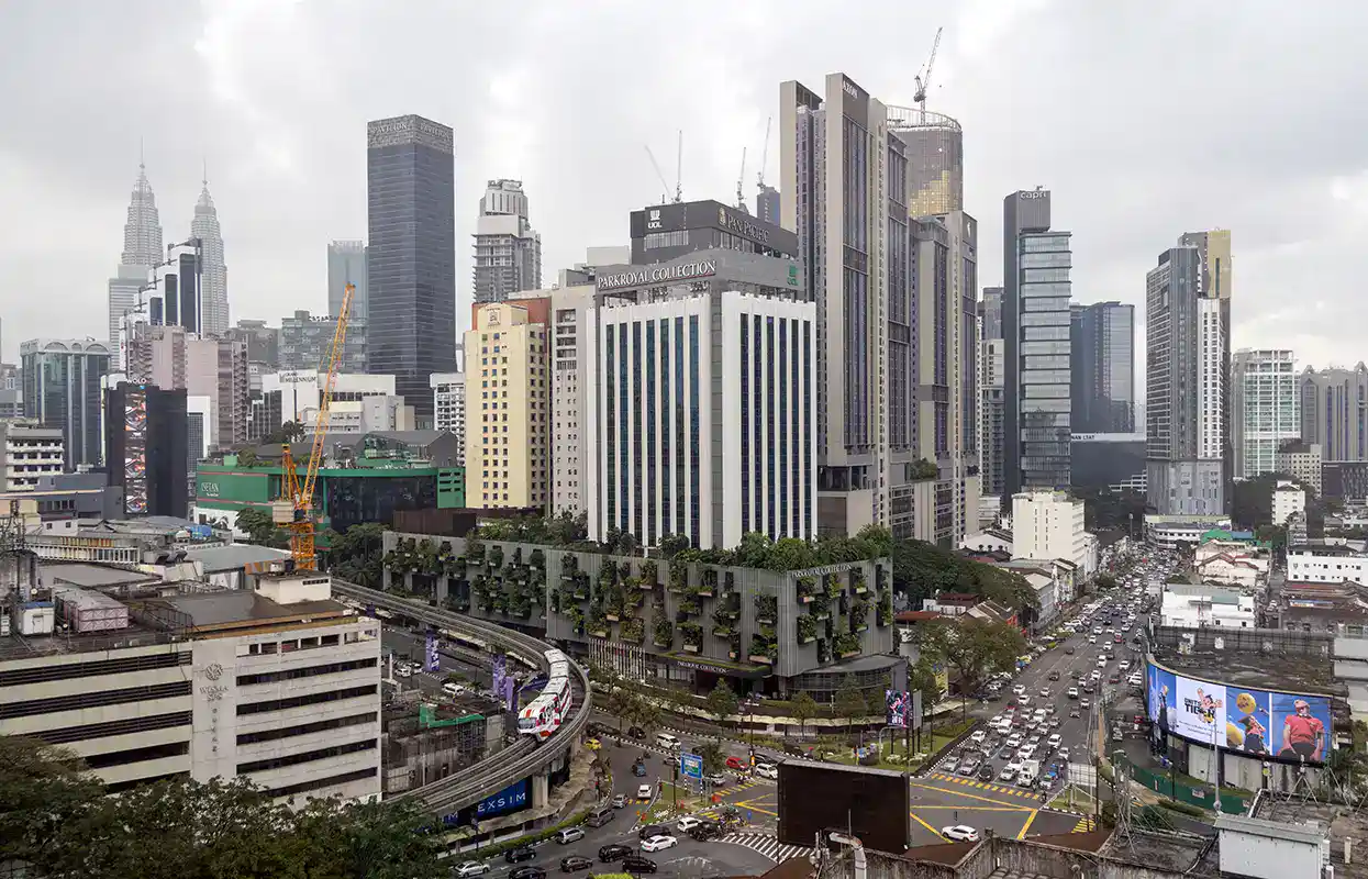Kuala Lumpur city skyline showing traffic and elevated rail tracks