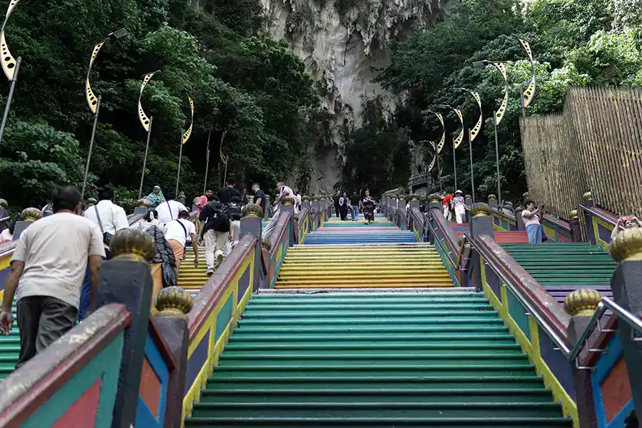 Visitors climbing the colourful 272 steps at Batu Caves near Kuala Lumpur
