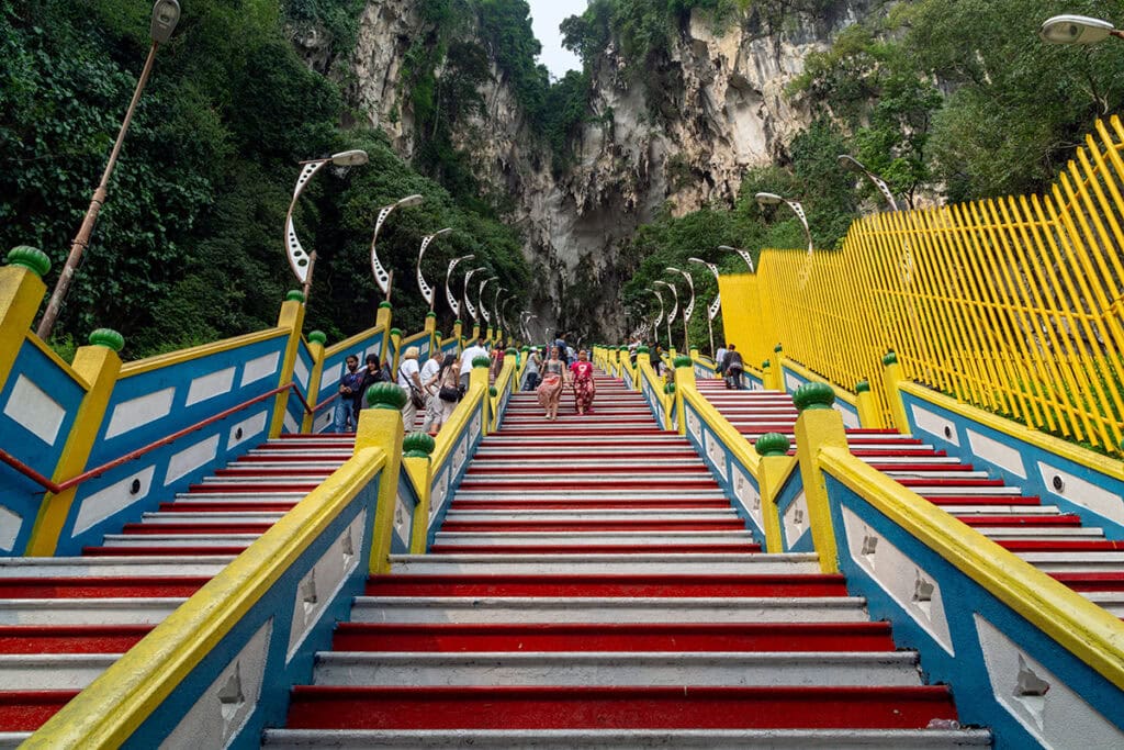 Batu Caves staircase painted in red and white before the rainbow stairs renovation in 2018