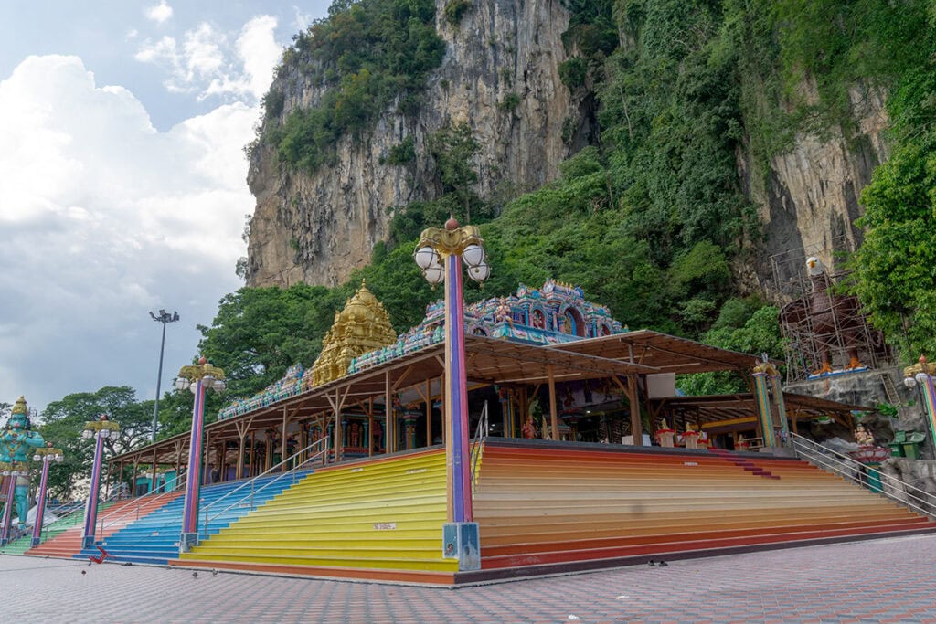 Sri Venkatachalapathi and Alamelu Temple at the base of Batu Caves beneath limestone cliffs