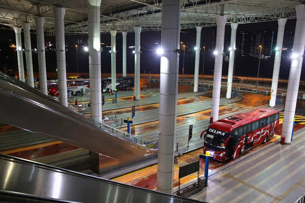 Long-distance buses waiting at Terminal Bersepadu Selatan (TBS) in Kuala Lumpur, a major hub for bus travel in Malaysia