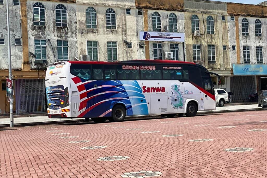 Sanwa Express bus to Tioman Island parked in Mersing town — public bus option from Kuala Lumpur to Mersing