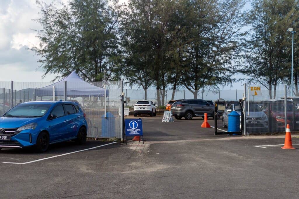Secure tourist parking lot at Mersing Jetty — designated Tempat Letak Kereta for travellers driving from Kuala Lumpur to Mersing