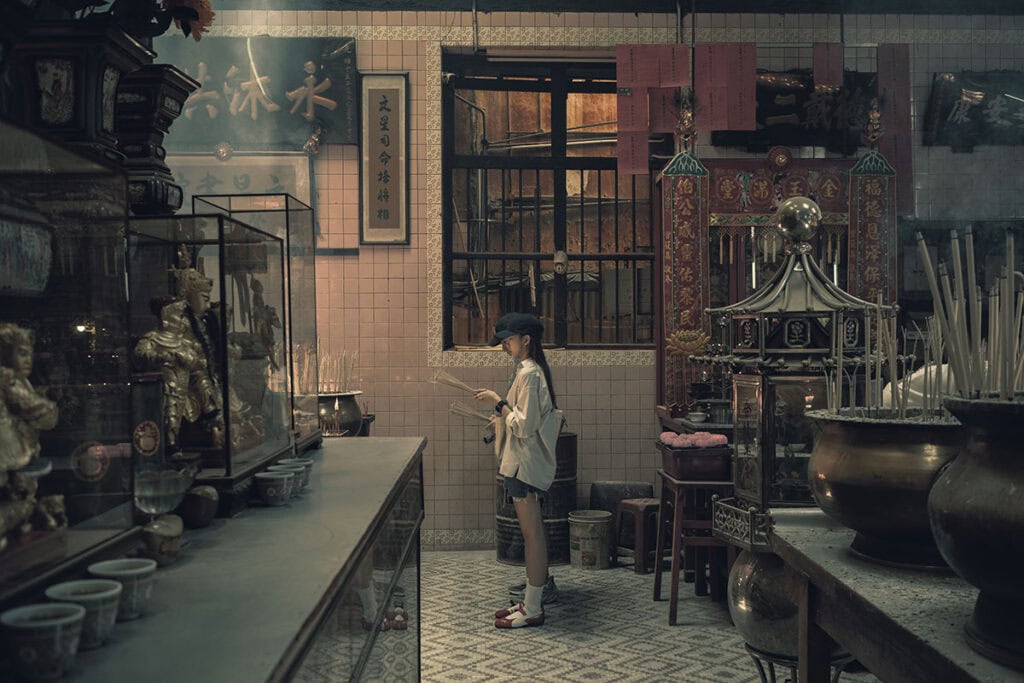 Visitor holding incense sticks inside Sin Sze Si Ya 
Temple, the oldest Taoist temple in Chinatown 
Kuala Lumpur