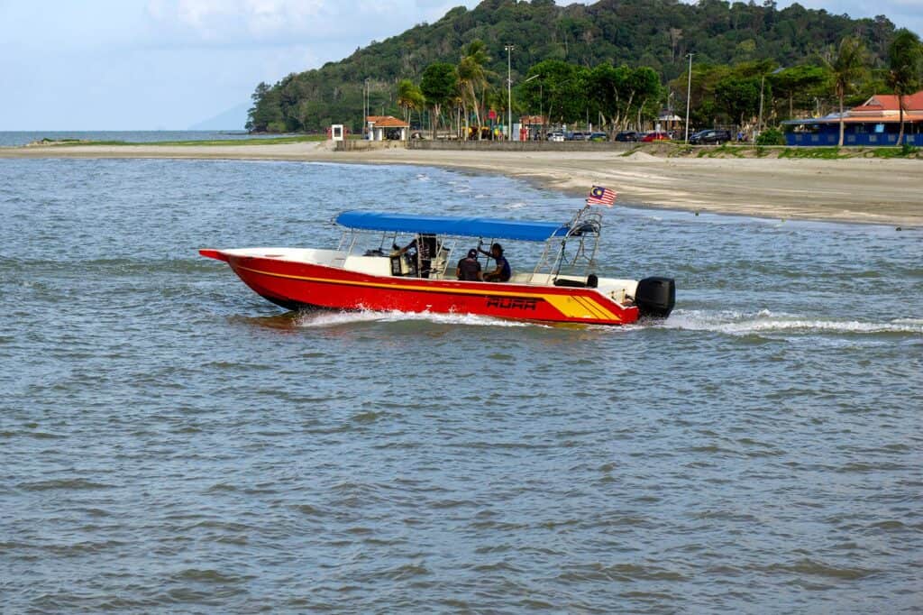 Aura speedboat departing Mersing Jetty for Tioman Island — faster crossing option taking approximately 45 minutes
