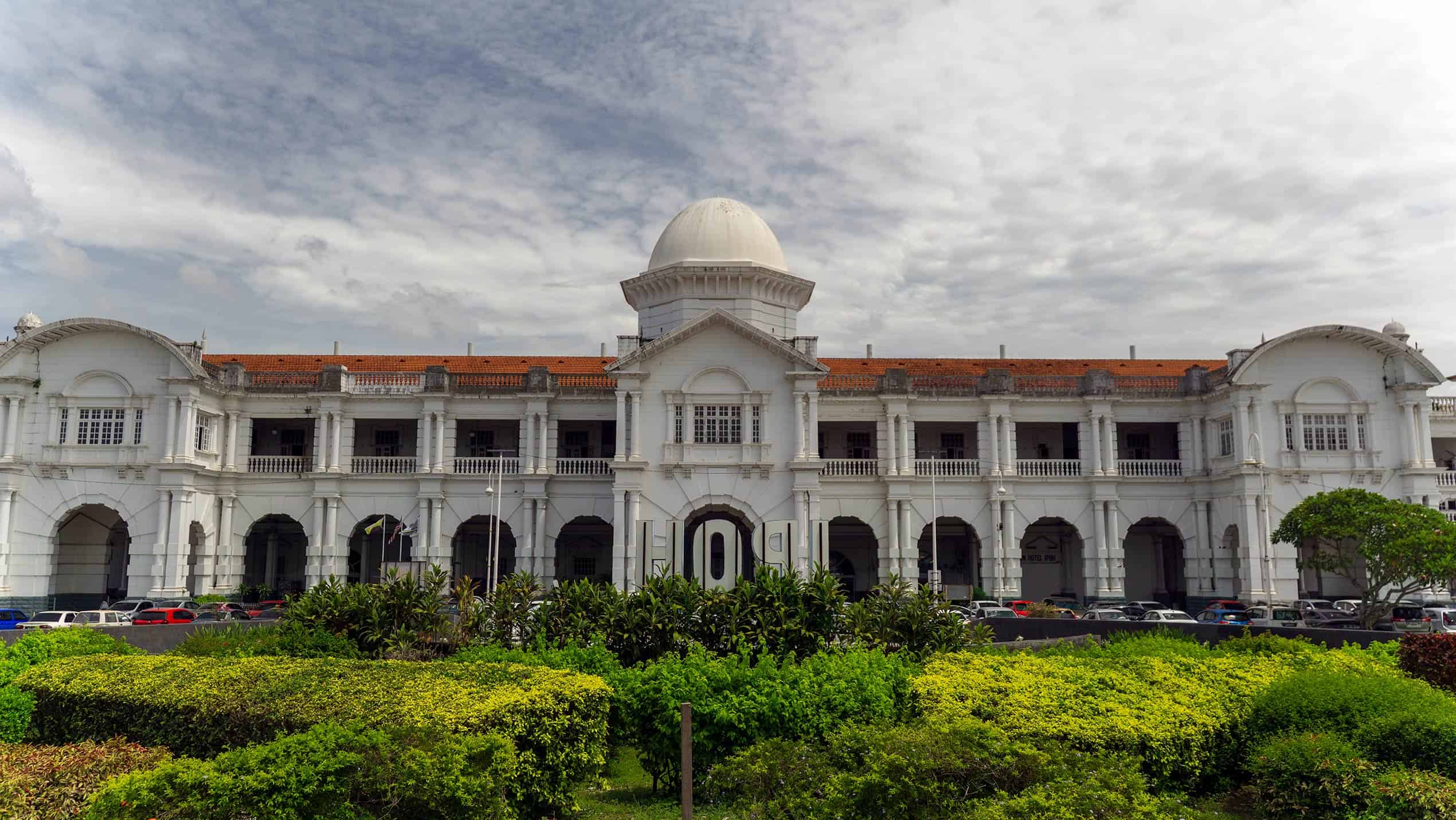 Ipoh Malaysia Railway Station colonial facade with white Moorish architecture and dome