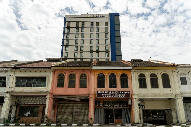 Hotel building on heritage street corner in Ipoh Old Town Malaysia with pre-war shophouses