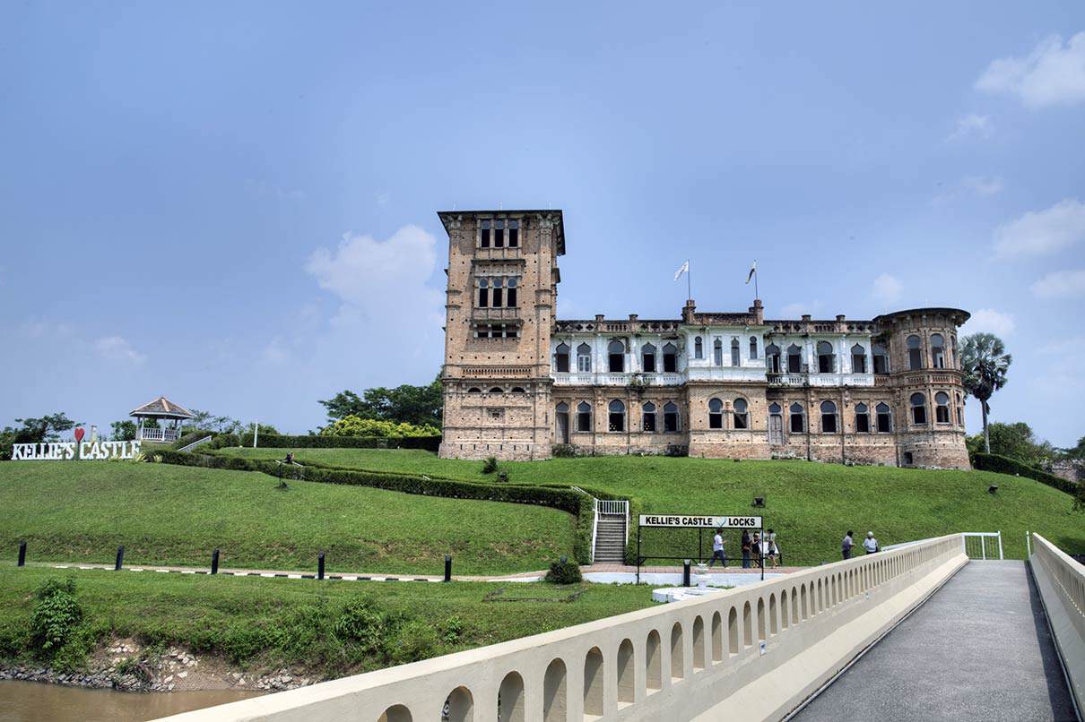 Kellie's Castle unfinished colonial mansion ruins on green hillside in Ipoh Malaysia