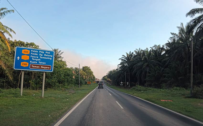 Road sign on the self-drive route from Kuala Lumpur to Taman Negara national park showing directions to Kuala Tahan