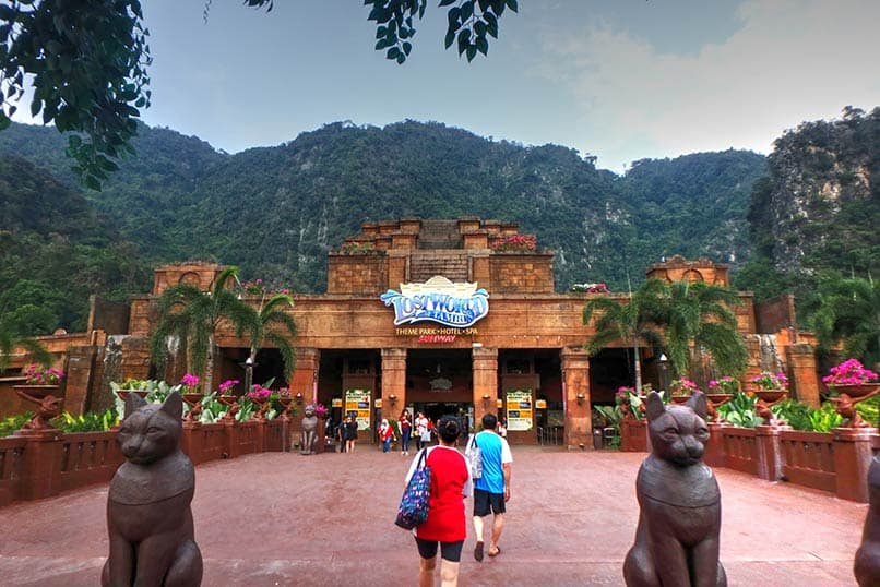 Lost World of Tambun entrance with limestone hills backdrop in Ipoh Malaysia