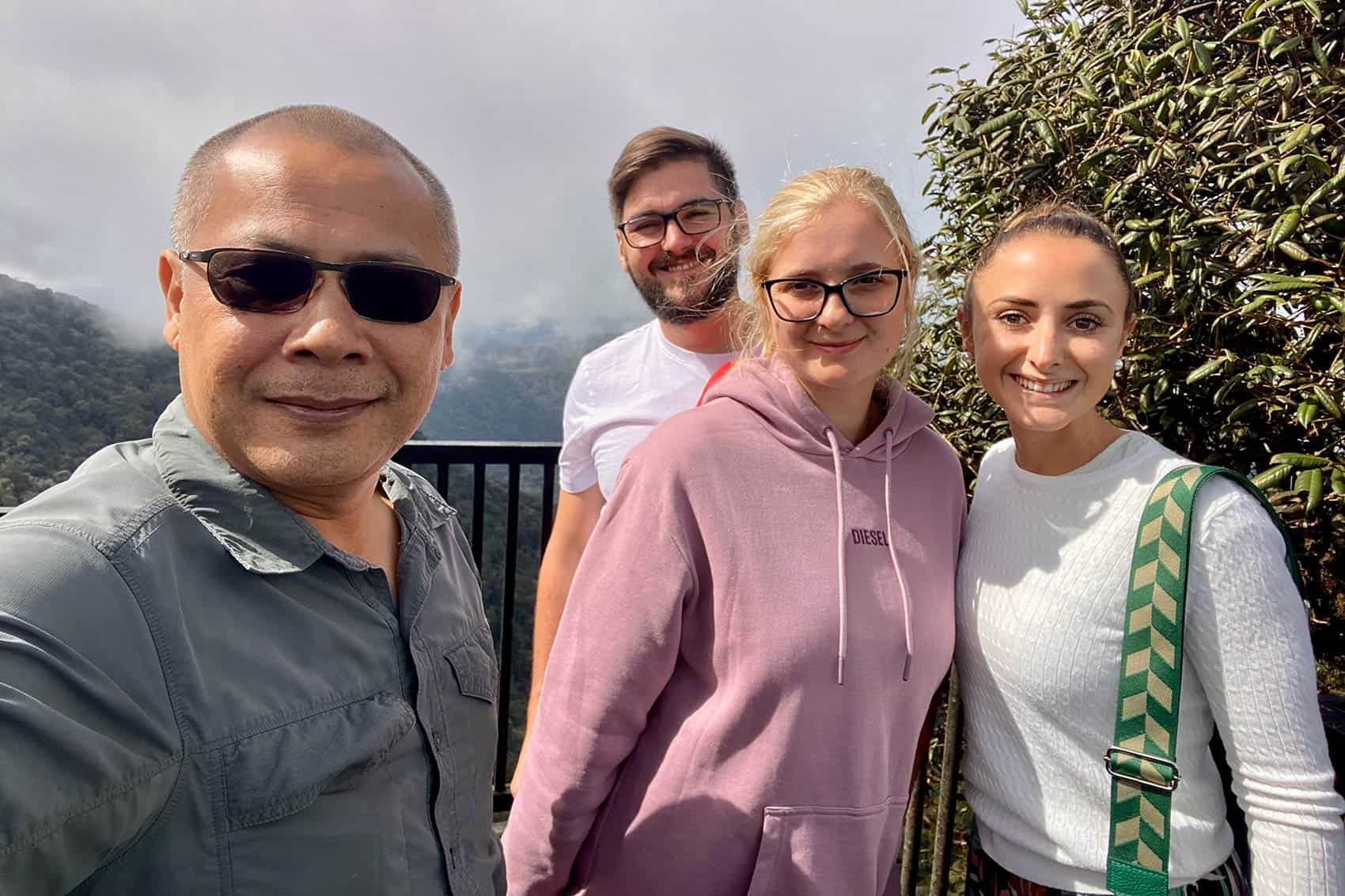 Anuar with guests at the Gunung Brinchang viewpoint, Cameron Highlands, on a privately organised day tour from Kuala Lumpur