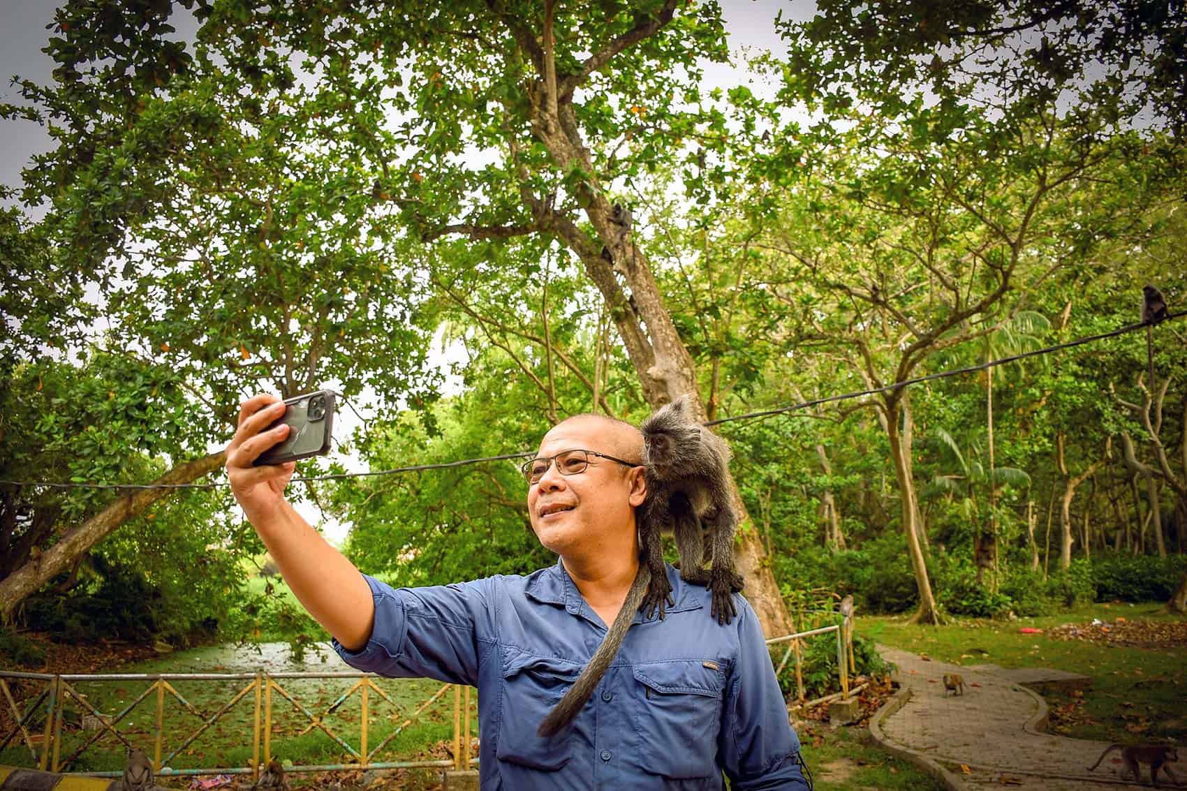 Anuar from We Go With Anuar with a silver leaf monkey at Bukit Melawati, Kuala Selangor