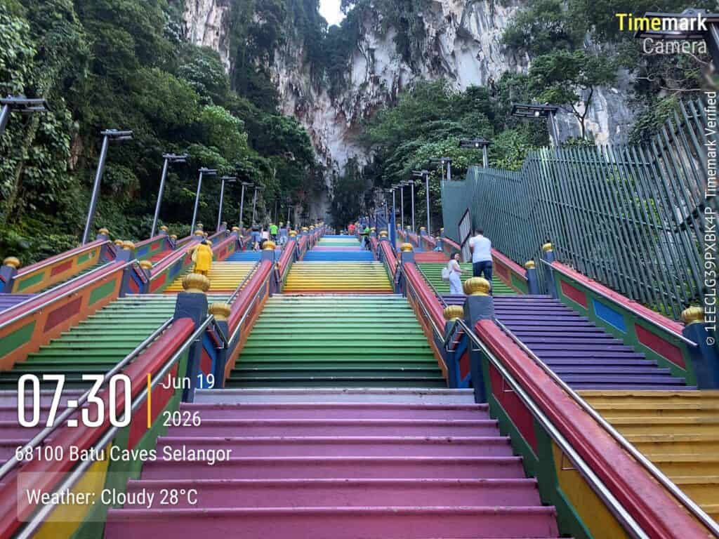 Batu Caves 272-step rainbow staircase at 7:30 AM with almost no visitors — best time to visit Batu Caves on a weekday morning, Selangor Malaysia